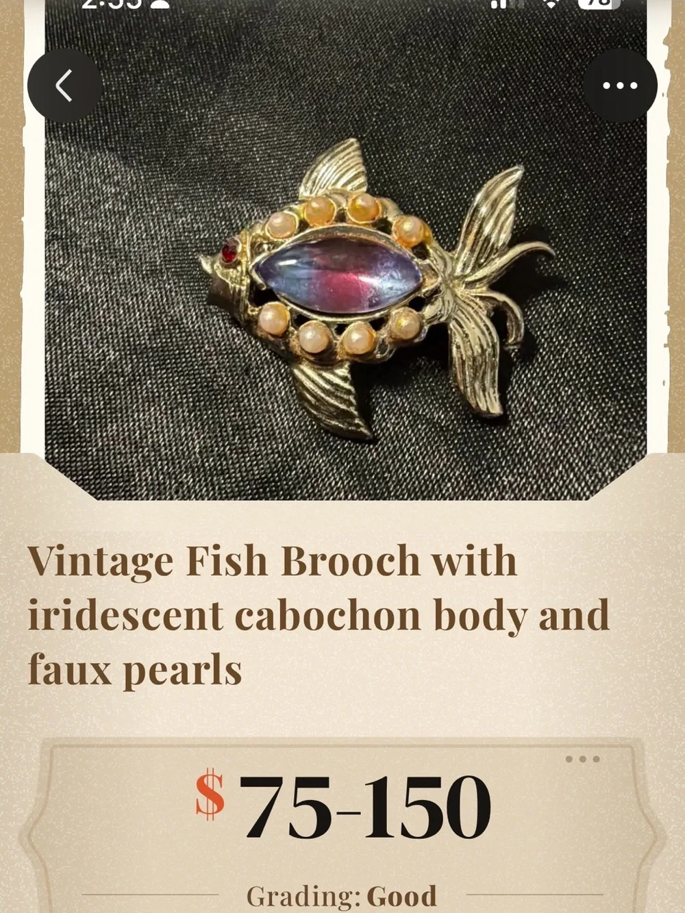Gold-Tone Decorative Fish Ornament with Purple Center Stone